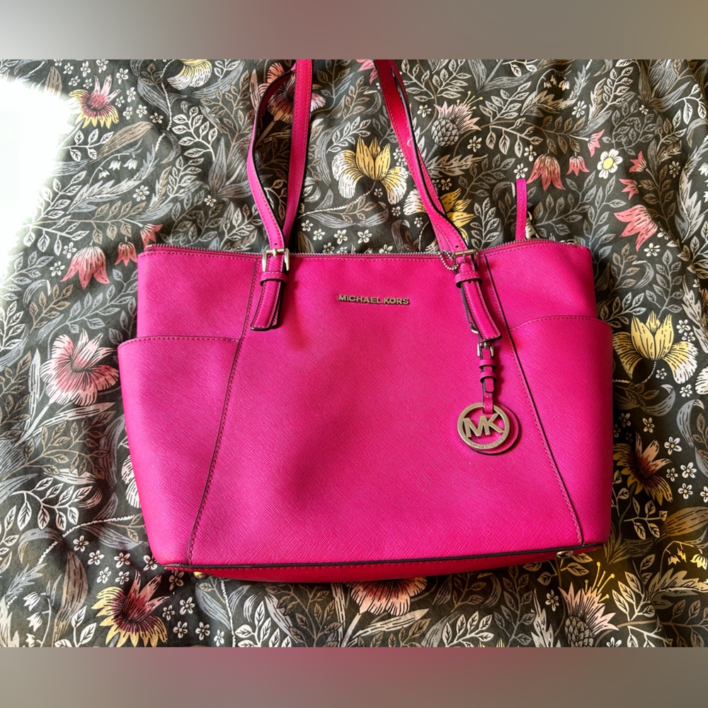 Hot pink Michael Kors purse. Straps are fraying